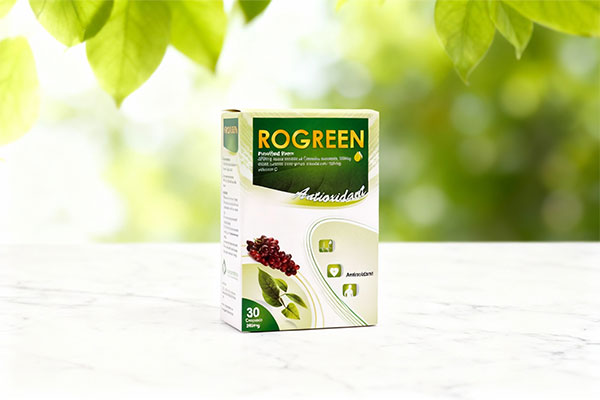 کپسول روگرین قائم دارو روی سطح سفید با پسزمینه سبز